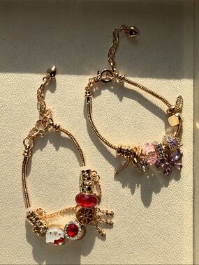 Gold-Tone Charm Bracelet with Red and Purple Accents - Set of 2